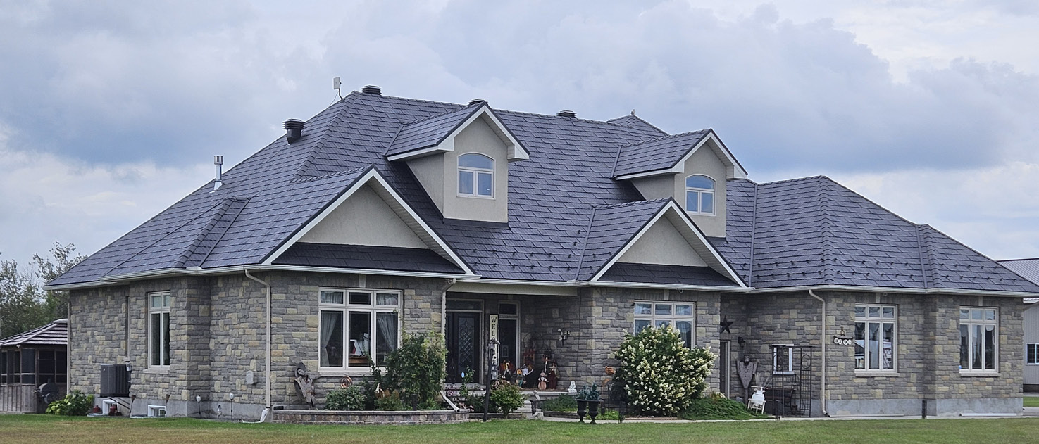 Stone estate with an Obsidian steel roof