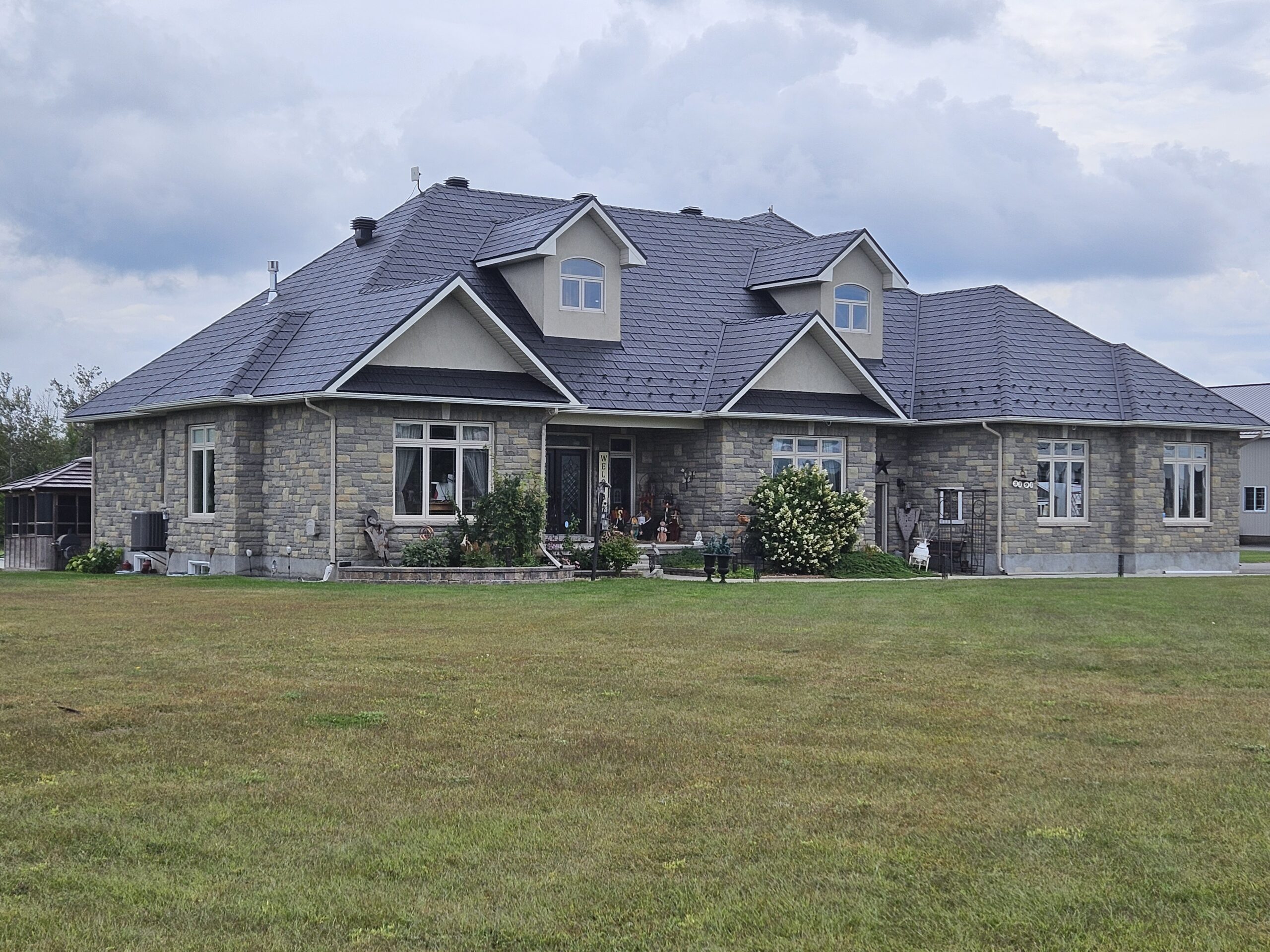 Stone estate roofed in Obsidian steel